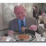 Peter enjoying a meal during retirement.