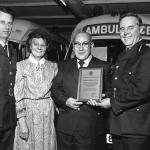 Reg Receiving his Retirement Plaque from Gordon Adams.