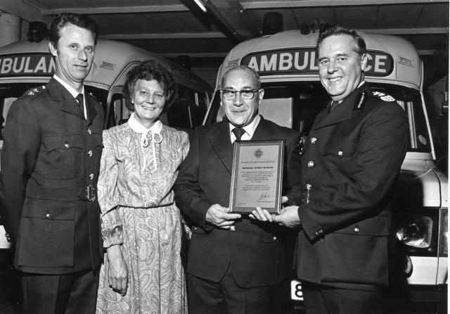 Reg Receiving his Retirement Plaque from Gordon Adams.