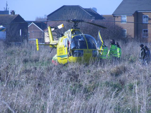 Patient being loaded on to the helicopter.